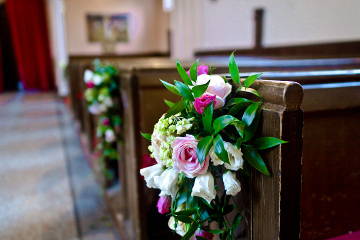 Floral pew ends for a wedding